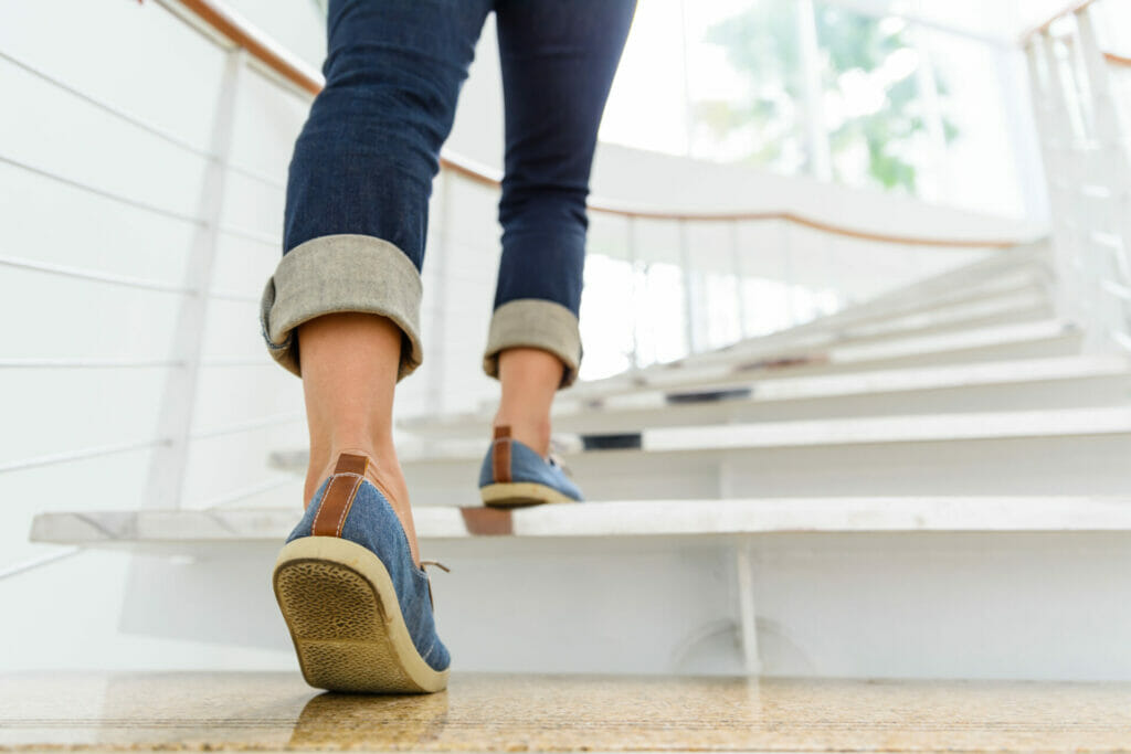 person walking up steps