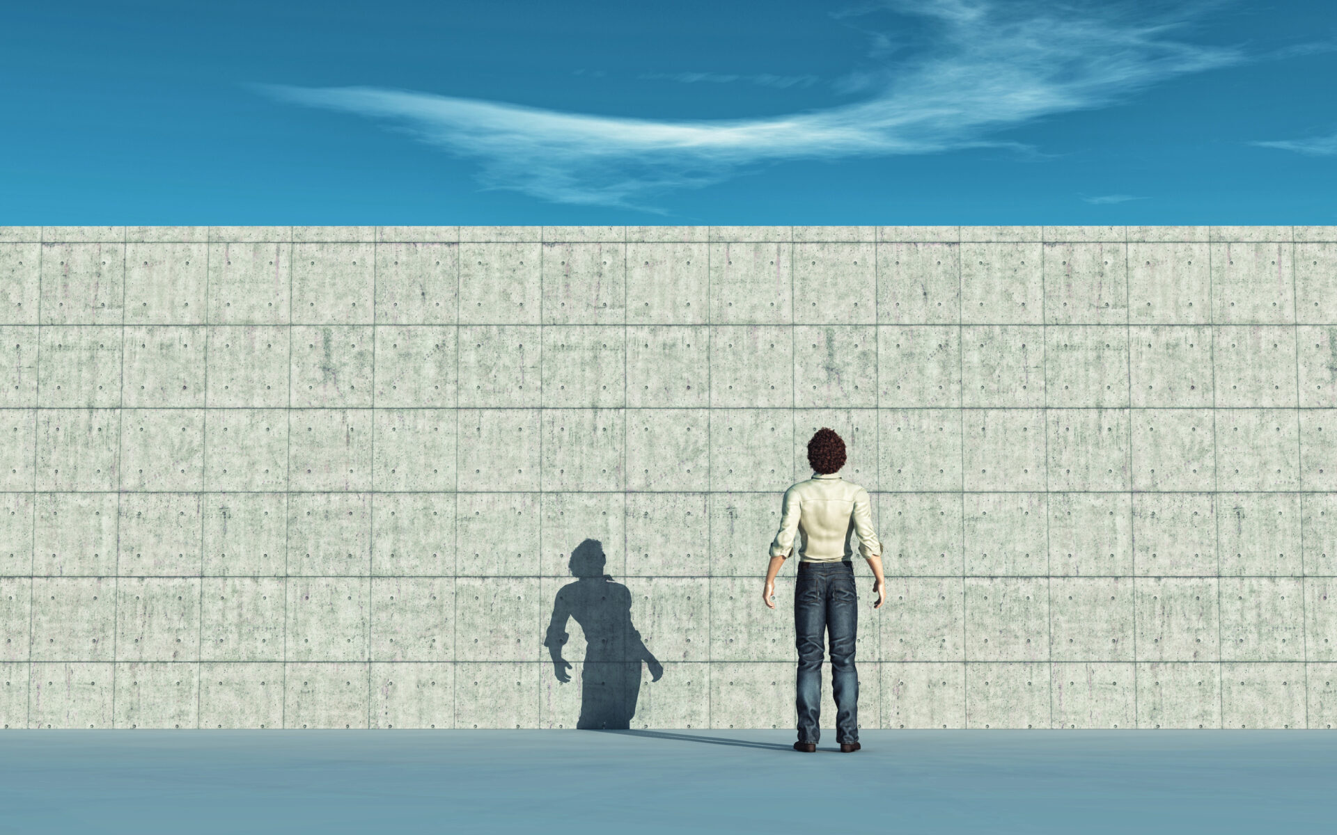 skyeteam image of a person standing facing a tall brick wall