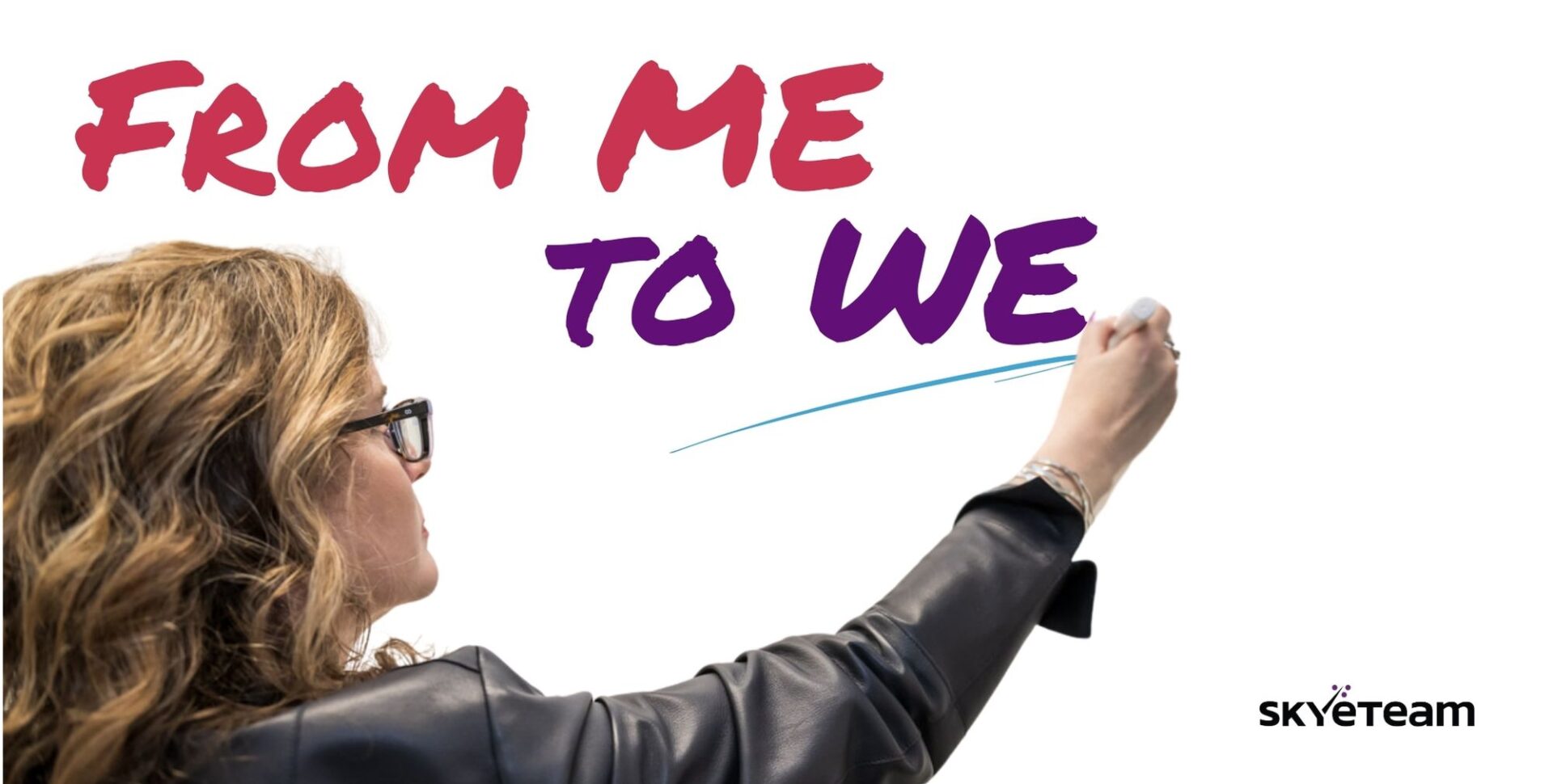 Morag Barrett writing on a whiteboard the words from me to we mindset