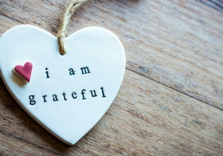 a heart shaped ornament with the words I am grateful written on it