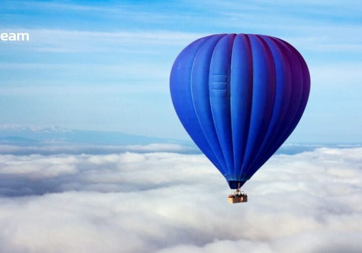 a blue hot air balloon above the clouds a metaphor for workplace loneliness and workplace relationships