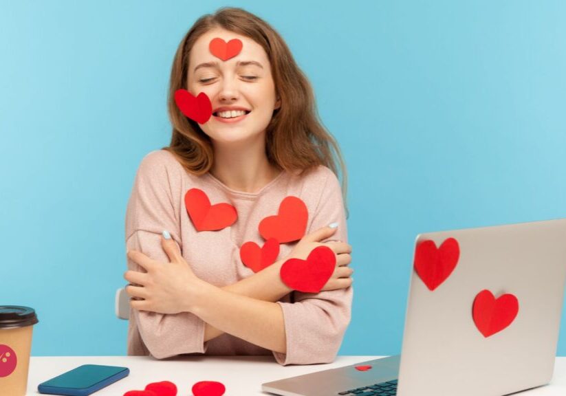 a woman at desk with a laptop and cup of coffee - professional relationship